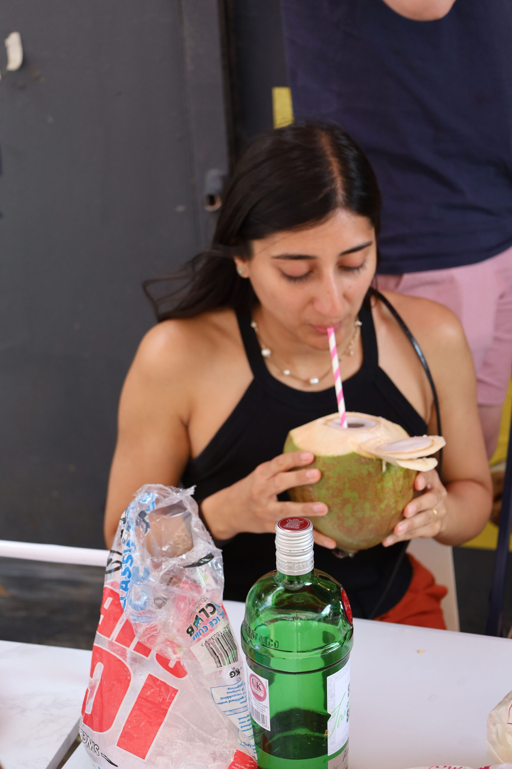 A guest enjoying fresh coconut water